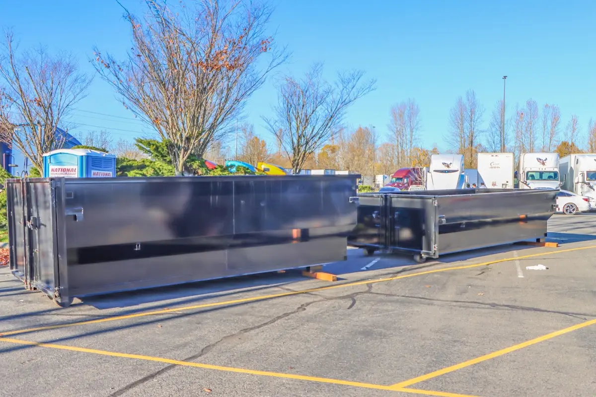 Professional dumpster rental service with roll-off container on residential driveway in The Villages